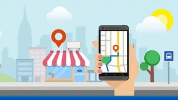 mano con móvil buscando negocio con Google My Business